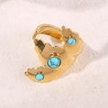 Adjustable golden leaf ring with turquoise stones on a natural textured stone base - 3D Leaf Open Ring / Turquoise Color