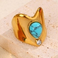 Vintage wide gold ring with teardrop turquoise stone and zircon on stone background - Blue Turquoise Texture Style (A4820)