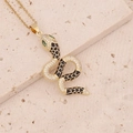 Détail du collier serpent doré avec pavé de diamants et écailles en émail noir - Noir