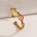 Gold bamboo-style open ring with orange opal stone and tiny white zircon accents - Pink Cat Eye Stone (A4934)