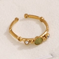 Adjustable gold bamboo ring with a green oval gemstone and sparkling white rhinestones - Light Green Cat Eye Stone (A4935)