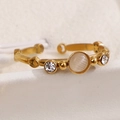 Adjustable golden bamboo ring featuring a round cat eye stone and white zircons - White Cat Eye Stone (A4937)
