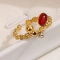 Vintage Ring aus Gold Titanstahl mit rotem Naturstein und floralem Hohlmuster Design - Rot