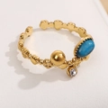 Vintage-Ring vergoldet mit ovalem blauem Stein, Metallperle und Zirkonia-Akzenten - Dunkelblau