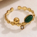 Bague vintage ajustable dorée avec pierre ovale verte et détails floraux en cristal - Vert