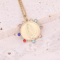 Detailed view of Virgin of Guadalupe gold medallion with colorful gemstones - Colorful Zircon Round Virgin Mary
