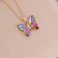 Close-up of butterfly pendant with iridescent gradient wings and golden chain details - Rainbow