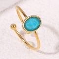 Minimalistische verstelbare gouden ring met ovale turquoise steen en kraalaccent - Blauwe Ovale Edelsteen (A4962)