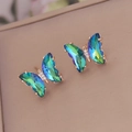Detailed close-up of rose gold butterfly earrings with vibrant gradient crystal wings - 925 Silver Pin Butterfly Studs / Peacock Green