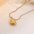 Elegant gold teardrop necklace with snake chain featuring organic shaped pendant on stone - Teardrop Pendant (A4984)