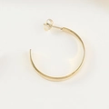 Exaggerated geometric C-shaped hoop earrings in a glossy golden finish with butterfly backs - Plain Smooth Style