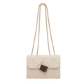 Beige quilted square crossbody bag with gold chain strap and metal lock detail - Off White