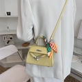 Pale yellow mini crossbody bag with graffiti embossing and striped silk scarf detail - Yellow