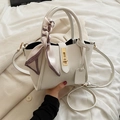 White litchi pattern bucket bag with silk scarf and gold lock hardware detail - White