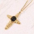 Collana con croce dorata, trama radiale e ciondolo con gemma nera ovale in stile retrò - Nero