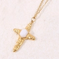 Gold cross necklace with hammered texture and white hexagonal stone on stone base - White