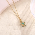 Close-up of starfish pendant necklace with turquoise enamel on golden stainless steel - Lake Blue