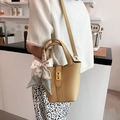 Khaki pebbled leather bucket bag with leopard print silk scarf and gold twist lock - Yellow