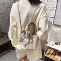 Chic apricot lychee pattern bucket bag with silk scarf handle and golden twist lock - Khaki
