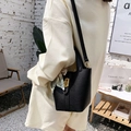 Classic black litchi leather bucket bag with gold lock and floral scarf on handle - Black
