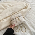 White quilted vanity case bag with gold camellia charm and chain strap detail - White