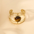 Gold plated multi-layer cutout open bangle featuring a natural tiger eye stone center - Brown
