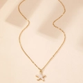 Dettaglio della collana a stella marina dorata con intarsio in madreperla bianca - Bianco perla