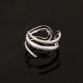 Polished silver hollow teardrop layered open ring on reflective black surface - Silver