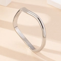 Minimalist silver wavy bangle with a sleek irregular polished finish for modern daily wear - Silver