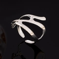Modern hollow geometric open ring in silver finish with a polished mirror surface - White Gold
