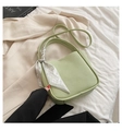 Light green pebble leather bucket bag with floral scarf handle in a lifestyle setting - Turquoise Green