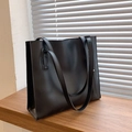 Minimalist large black leather tote bag with long shoulder straps for daily commuting - Black