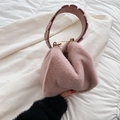 Chic light pink faux fur handbag with unique petal-textured handle and gold rings - Pink