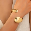 Minimalist gold open cuff bracelet with irregular geometric curves and mirror finish - Gold Yellow