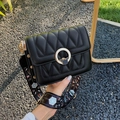 Black quilted crossbody bag with a gold stag buckle and a wide floral printed strap - Black Deer Head