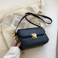 Chic black vintage leather flap bag with geometric edges and a gold metal lock - Black