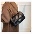 Classic black quilted shoulder bag with gold chain strap and metallic twist lock detail - Black