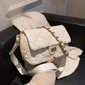 Quilted white crossbody bag with gold chain strap and textured leather finish - White