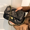 Elegant black quilted leather shoulder bag with gold chain strap and turn-lock closure - Black