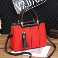 Red lychee grain leather tote bag with dark brown straps and fringe tassel charm - Red