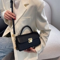 Classic black faux crocodile leather handbag with elegant gold clasp and top handle - Black