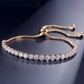 Adjustable gold tennis bracelet with 4mm round clear crystals and a sliding clasp - 18K Gold