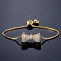 Adjustable gold bow bracelet with white zircon stones and adjustable slider box chain - Gold