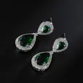 Elegant silver drop earrings featuring deep green pear-cut stones and zircon halo - Green