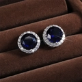 Classic silver halo stud earrings featuring a deep blue round zircon with white accents - Large (8mm) / Blue