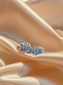 Eternity ring with baguette-cut blue crystals in a silver-tone setting on champagne satin - Blue Zirconia Silver Band