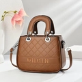Caramel brown quilted handbag with silver hardware and detachable strap on white background - 24cm x 9cm x 18cm / Earthy Yellow