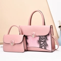 Close-up of pink two-piece handbag set with animal texture and gold ring buckle - Pink