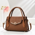 Detailed view of dark brown woven leather handbag with elegant gold wavy buckle and dry flowers - L28 W10 H17 / Brown