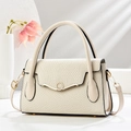 Close-up of beige woven texture handbag with crystal-encrusted gold ring lock detail - L28 W10 H17 / Off White